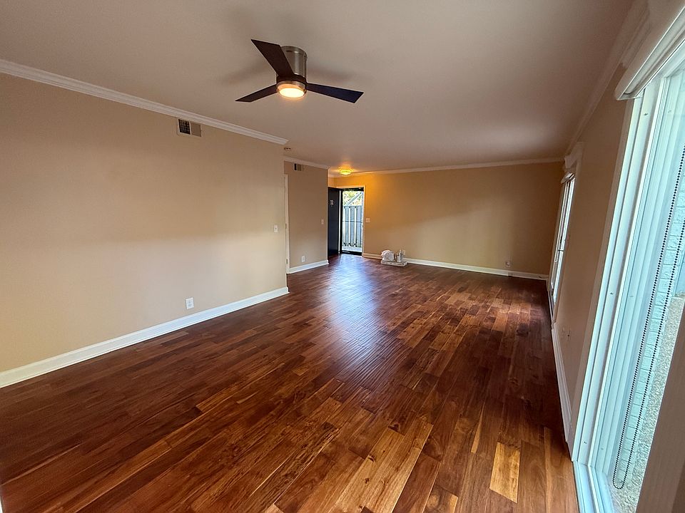 Looking back to the entry door and large great room . Wood floors