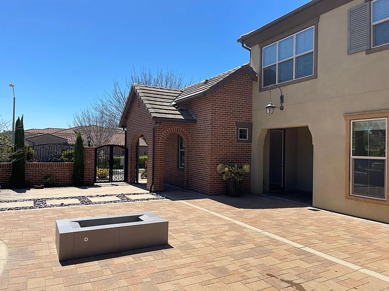 View of private studio and entrance with patio area.