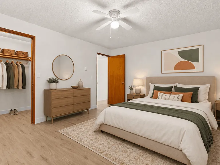 Spacious bedroom with generous closet storage in a one-bedroom deluxe apartment at Palisades Apartments in Tacoma.
