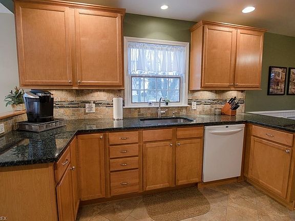 Granite counters and tiled splash are just a few of the features in this magnificent Kitchen.