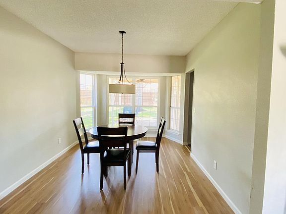 Dining room with bay window views to back yard / patio