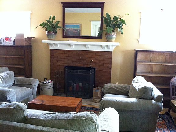 Front room w/ wood-burning fireplace