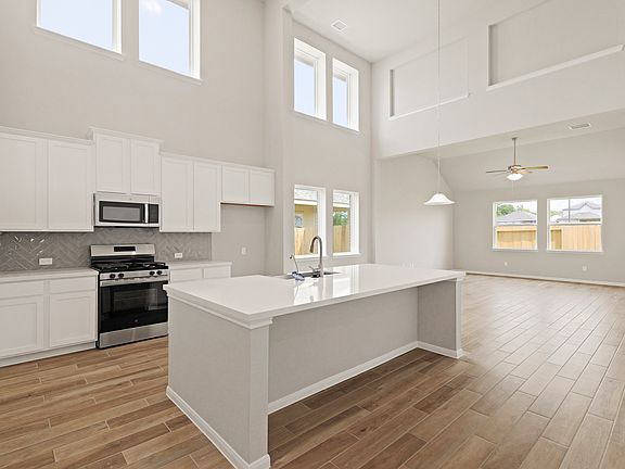 Kitchen with soaring two-story ceiling