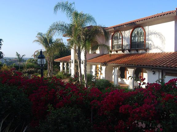 Dual gated driveway with room for at least 10 vehicles.