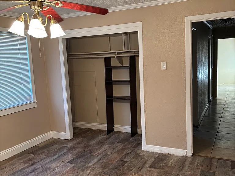 Master bedroom with ceiling fan.