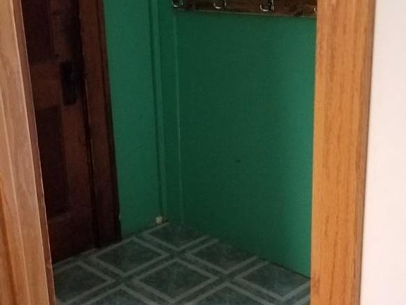Hallway leading to basement