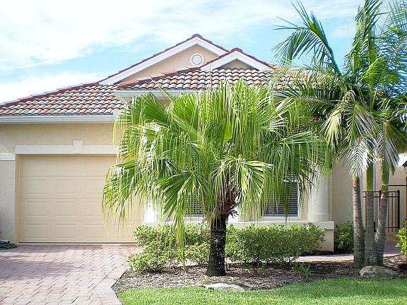 Paver brick driveway & walkway adds to the curb appeal! Note the tile roof!