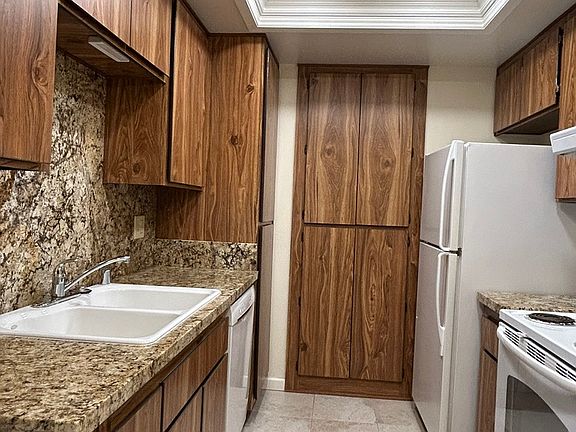 Kitchen with granite countertops and porcelain floor