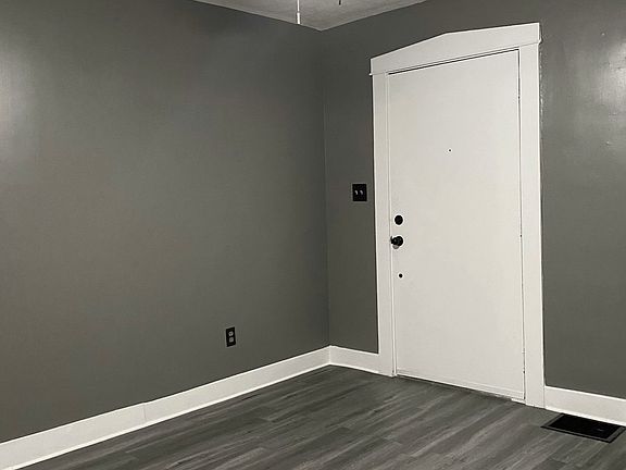 Living room area, entering front door