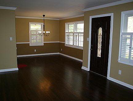 Large Living/Dining room with gorgeous newly refinished hardwood floors, new lighting and new fiberg