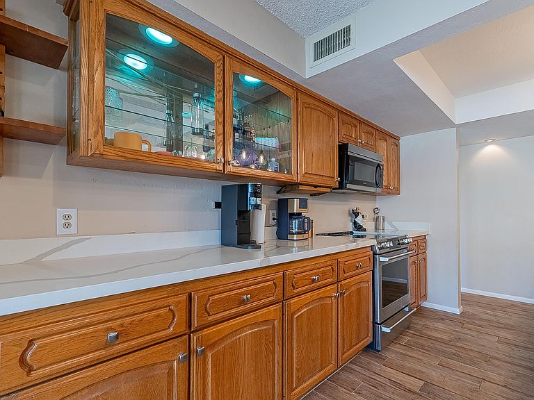 Kitchen cabinetry and stainless appliances
