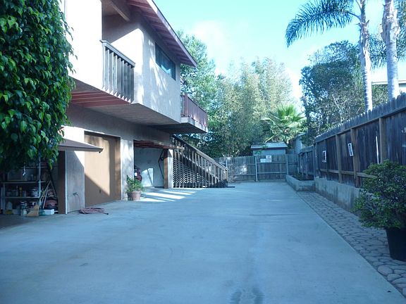 EXTERIOR OF 3 UNIT LAYOUT DRIVEWAY