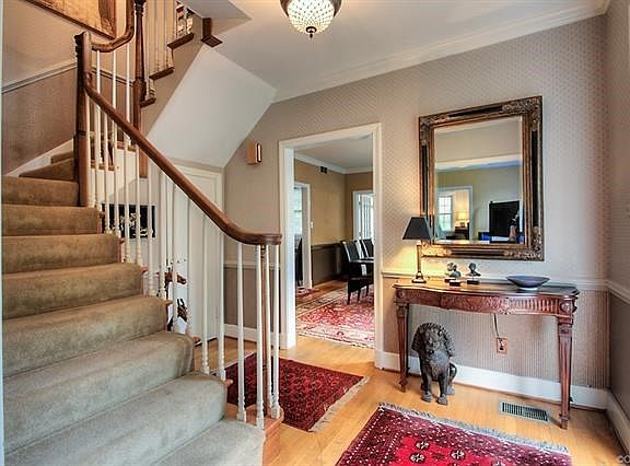 Grand Entry Hall with wrap around staircase.