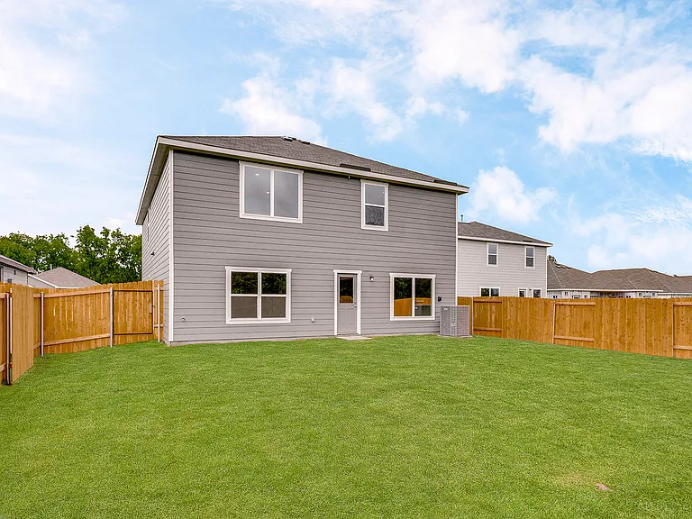 The back yard is fully fenced-in.