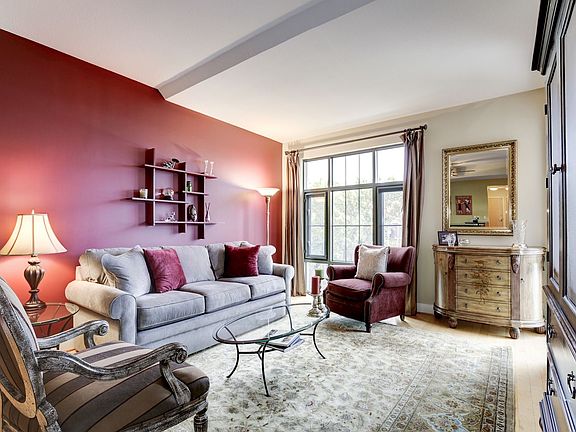 Sitting room area, with kitchen to left and back, and with master bedroom to the right.