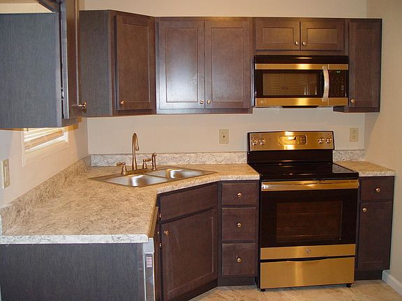 Kitchen has updated plumbing and appliances; renter supplies own refrigerator