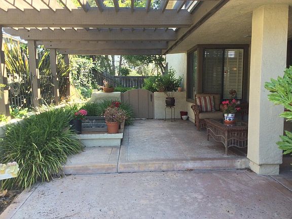 COVERED PATIO WITH KOI AND FOUNTAIN POND