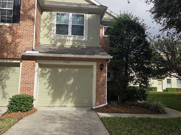 Beautiful updated townhouse in gated Brightwater community with garage and lake view