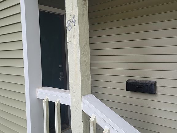 The door is being repainted to a lighter color to brighten the space.