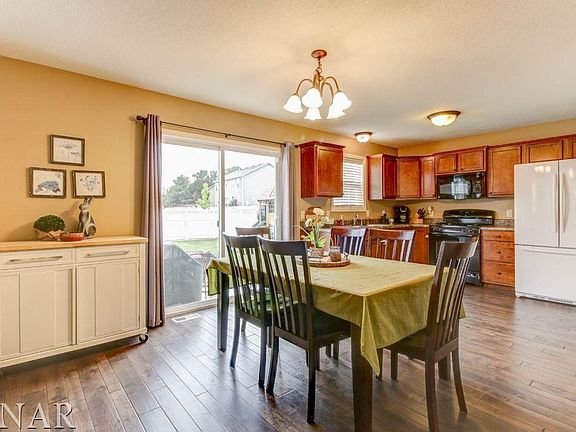 Huge eat-in kitchen; beautiful wood floors installed in 2015. Island can be rolled into the kitchen
