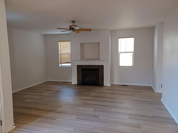 Mainfloor living area, opposite kitchen w/ gas fireplace