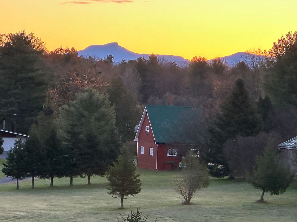 Camels Hump is seen from the kitchen and LR windows on the east side. The red barn is on the neighbor's land, about 400 ft distant.