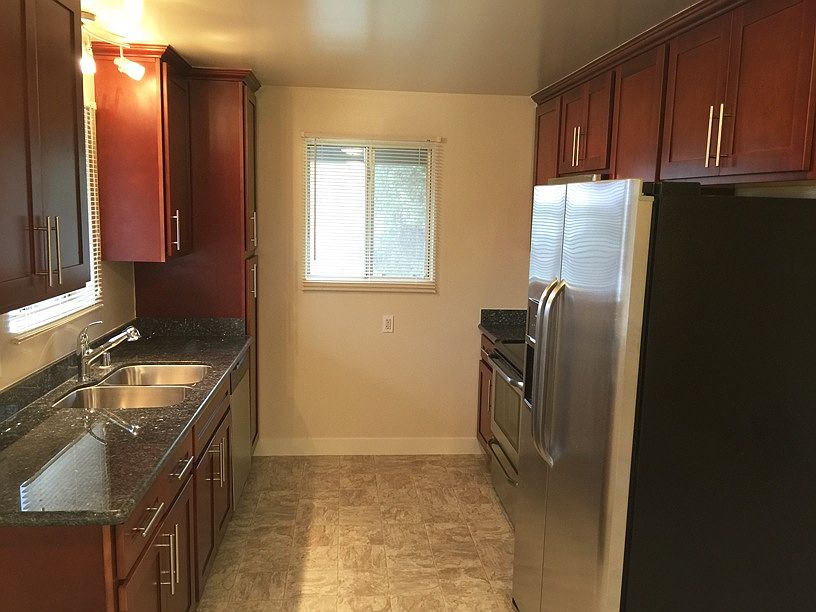 Brand NEW Granite slabs and Cherry wood cabinets