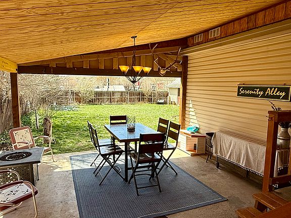 Covered dining area with propane gas fire-it. Huge backyard!
