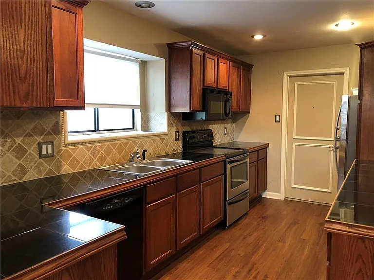 The kitchen has a nice window for natural light. Lots of counterspace. Fridge included.
