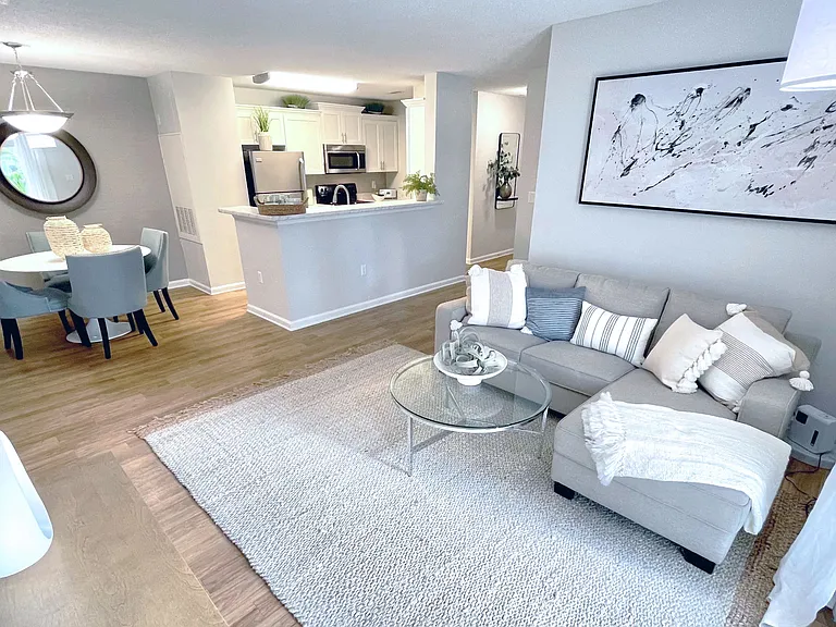 Experience the beauty of open concept living at Emerson Isles, where your living room seamlessly connects to the dining and kitchen areas. A space designed for both style and sociability!