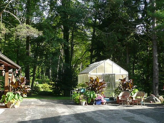 parking next to green house