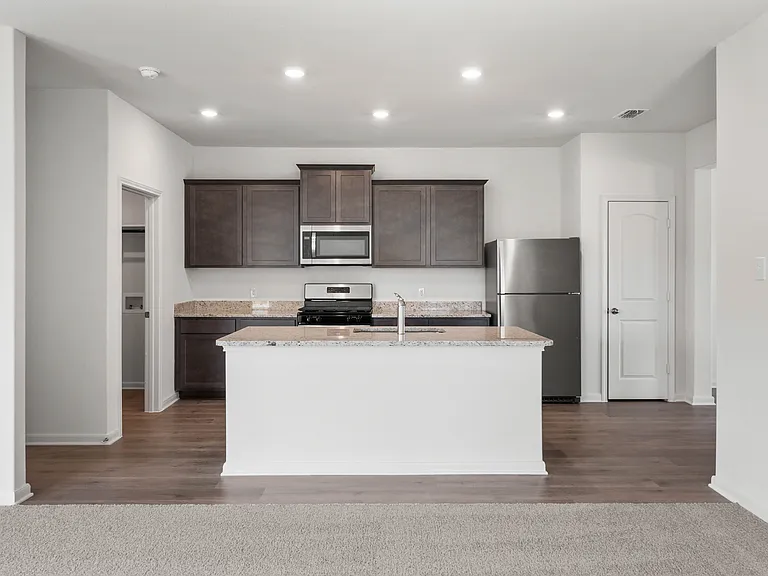 The kitchens have designer wood cabinetry.