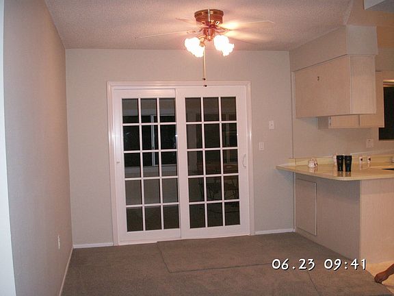 new vinyl sliding door to covered patio