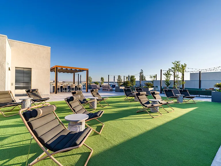 Soak up the sun and stunning views at Modera Pomona's rooftop oasis! With ample seating and a relaxed atmosphere, it's the ideal spot to unwind, entertain, and enjoy the beauty of California.