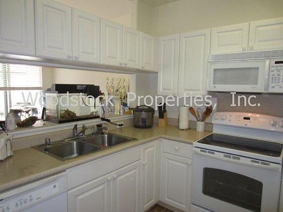 Double stainless steel sink, garbage disposal, dishwasher.