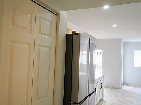 Kitchen pantry and brand new refrigerator