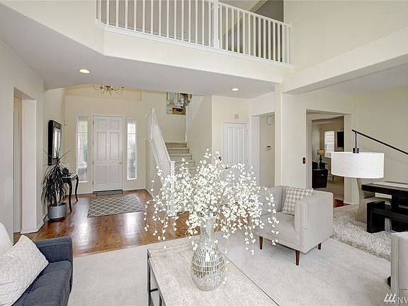Light and bright with a grand foyer and vaulted ceilings
