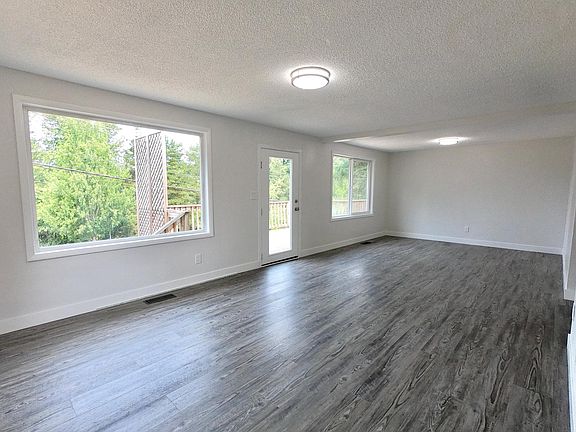 Open concept living and dining room - new floors, vents, paint, millwork, doors, lighting