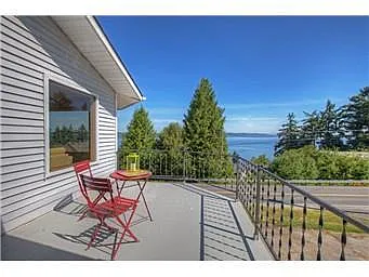 Deck with Puget Sound view. - 8405 Eastside Dr NE #A