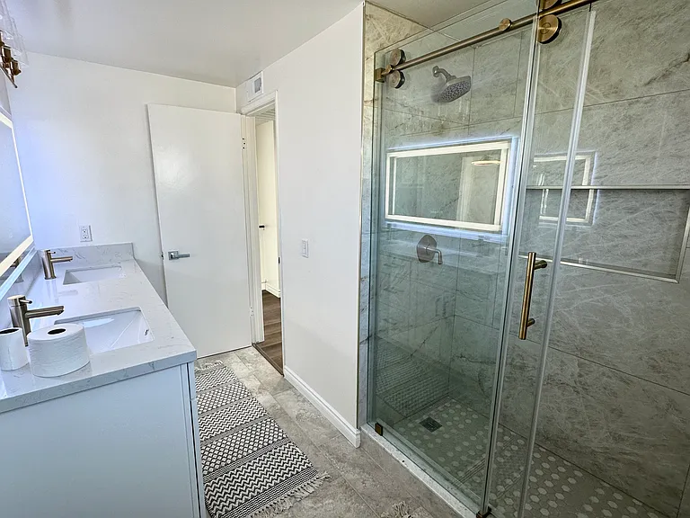 Hallway Bathroom on second floor
Fully renovated with double sink vanity, plenty of storage and led mirror