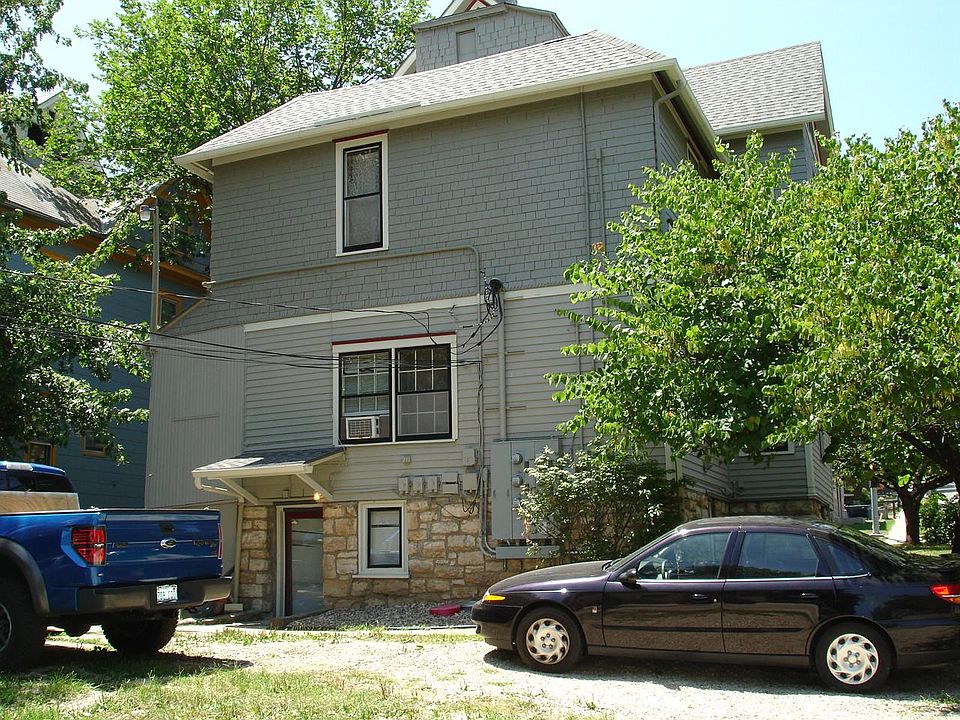 Back of house with free, private parking outside of entrance to apartment.