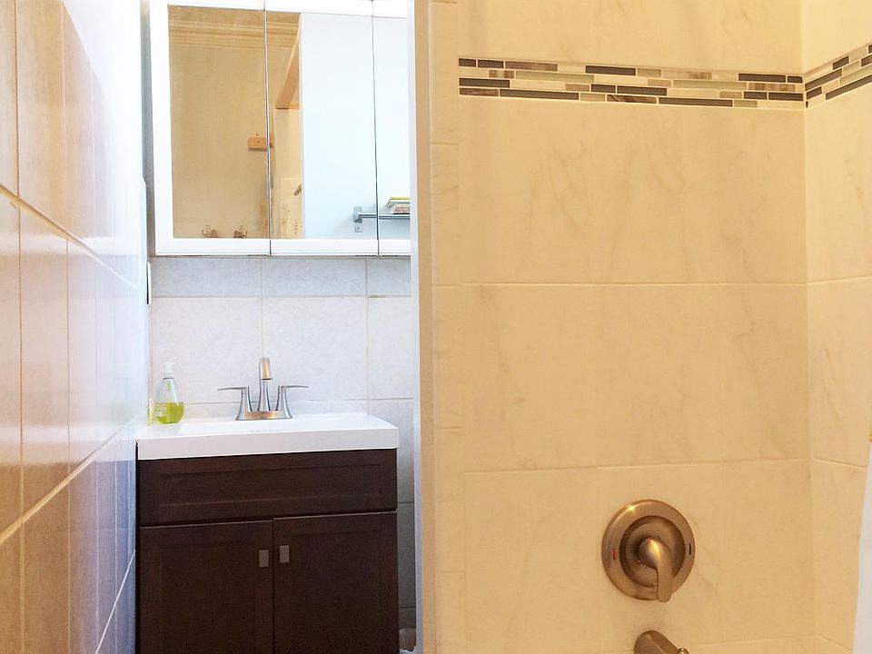 Newer tile & vanity in bathroom