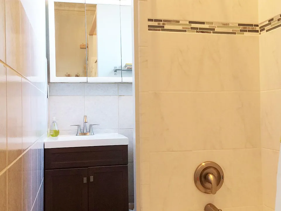 Newer tile & vanity in bathroom