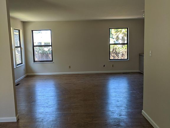 Dining room with Living room in background