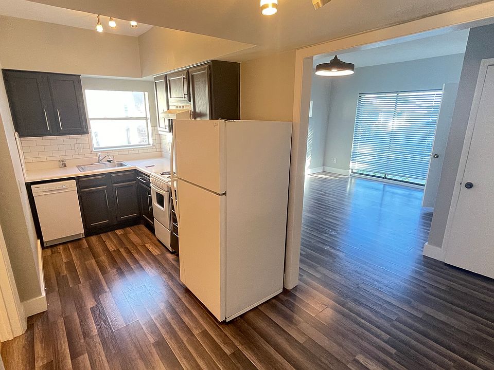View of living/sleeping area and updated kitchen from the cozy dining nook.