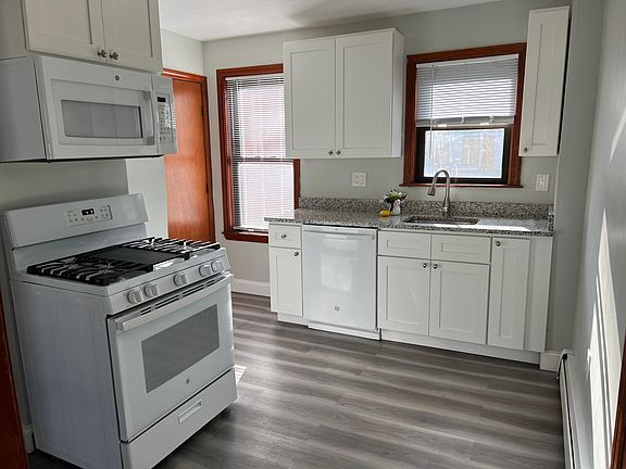White cabinetry, granite countertops, dishwasher and gas range!