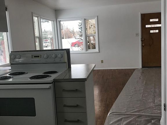 View from kitchen into living area/front door