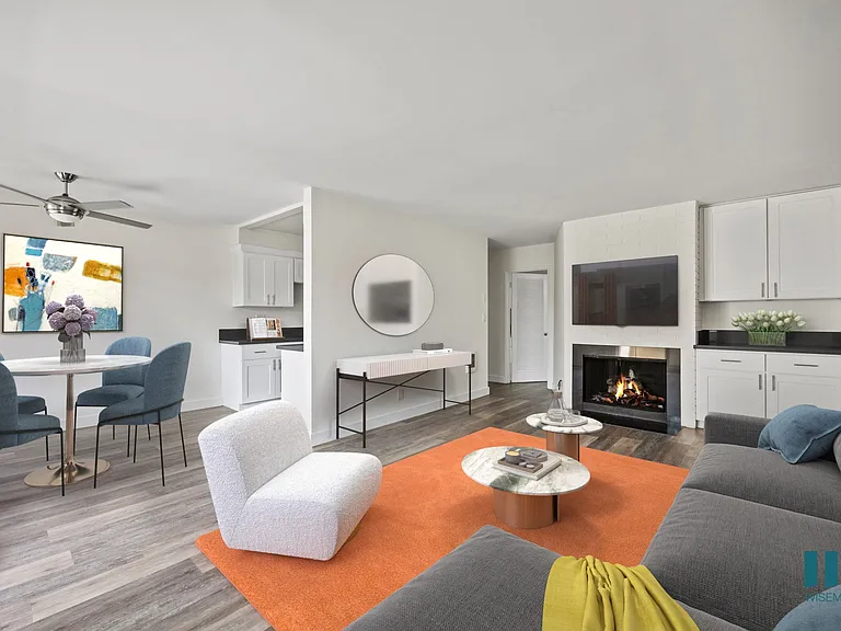 Open-Concept Dining and Living Room with Fireplace and Vinyl Flooring
