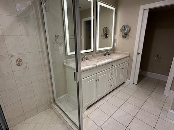Master Bath Dual Hi-tech Adjustable Mirrors (brightness, color, steam-defrost) over Vanity and part of dual-showerheads