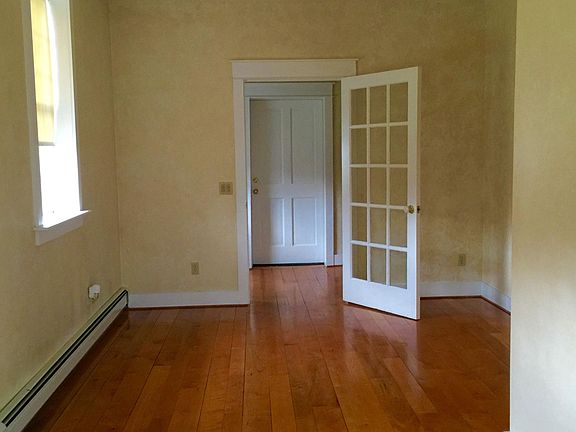 Foyer with 1/2 bath , Living room with original hand blown g